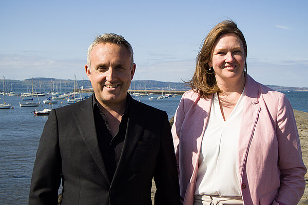 Alex Cole Hamilton and Sanne Dijkstra-Downie MSP at Wardie Bay, with the pier and ocean behind them