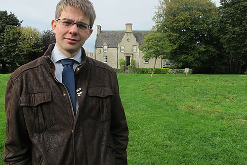 Jack in front of Pilrig House and a green park