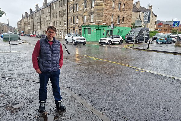 Jack Caldwell standing at a busy junction