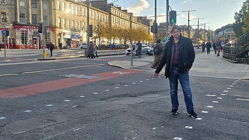 A man pointing at a sunken crossing