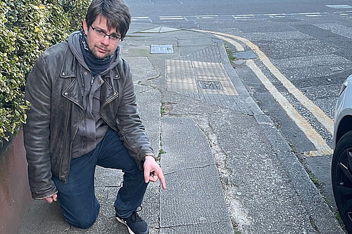 Jack pointing at a pavement