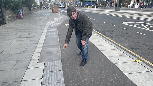 Jack Caldwell pointing at tactile pavements