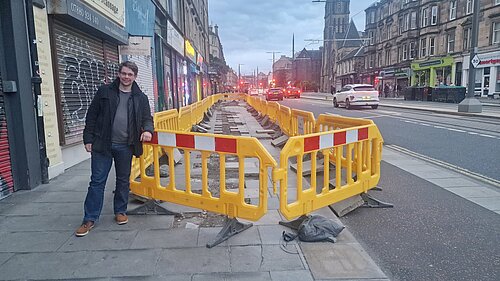 Jack Caldwell standing by roadworks