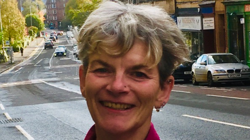 Councillor Pauline Flannery with a road behind her