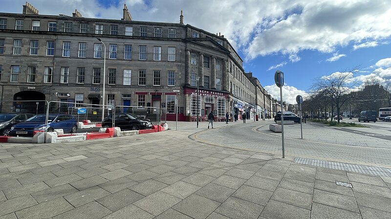 A picture of Elm Row with temporary barriers at Montgomery Street