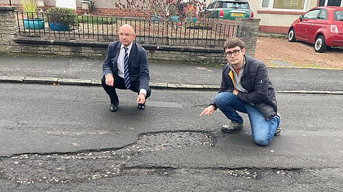 Lib Dem cllrs with potholes