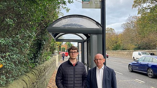 Local Lib Dem councillors at a bus stop
