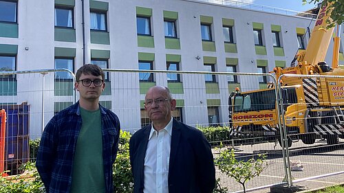 Cllrs Aldridge and Thornley at Craigievar House, a three-storey building of flats, after the fire in 2023.