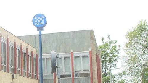 Police Station with a flagpole sign