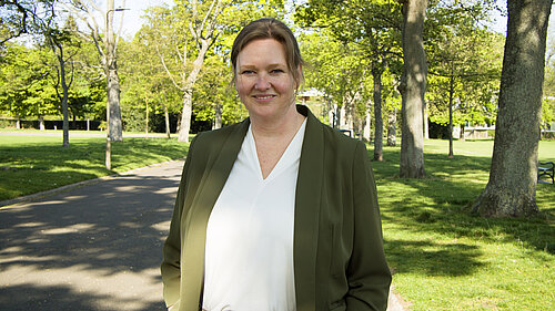 Sanne standing in a park