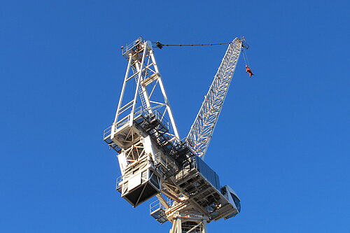 Crane with blue sky behind it