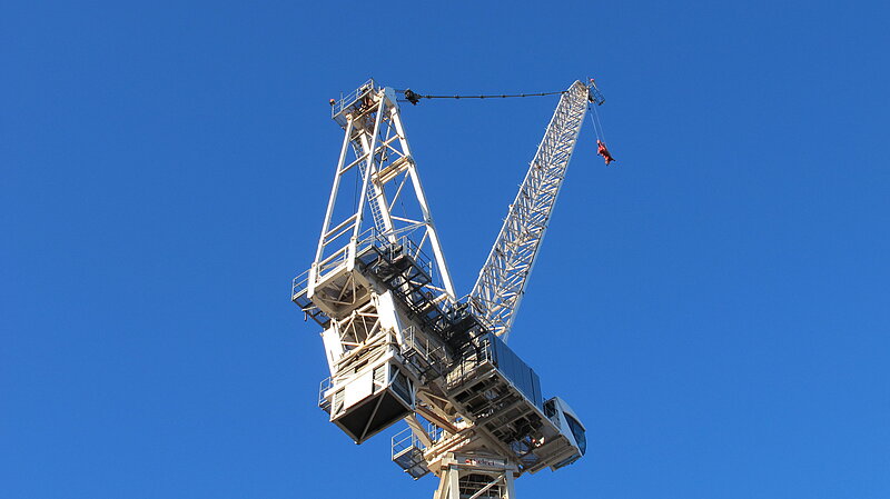 Crane with blue sky behind it