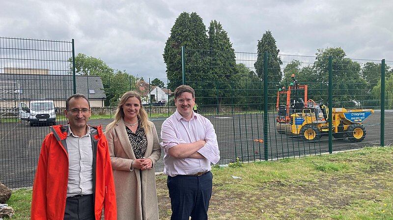 councillors standing outside the tennis courts