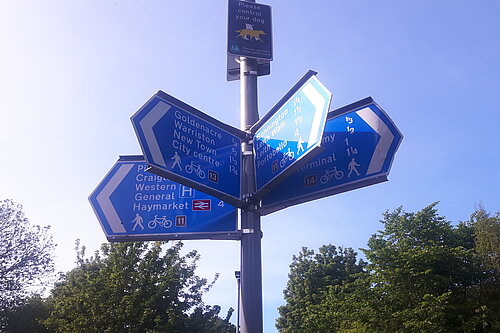 Signs on the North Edinburgh Path Network pointing to Goldenacre, Warriston, City Centre and Bonnington 