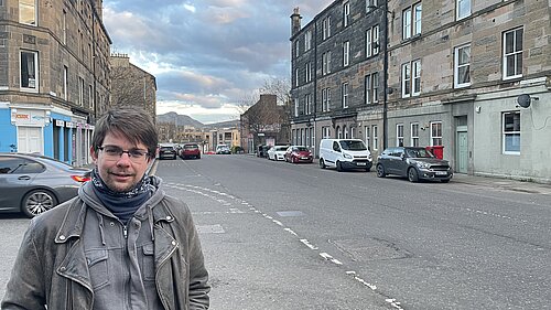 Jack Caldwell standing by a wide road